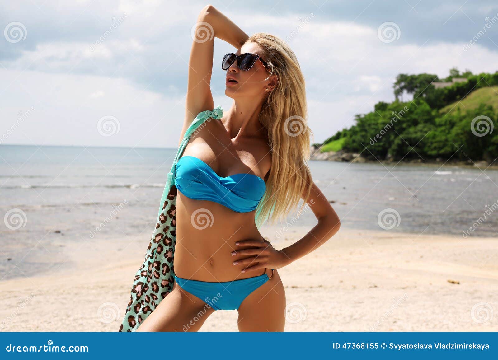 Sexy Woman With Blond Hair In Bikini And Sunglasses