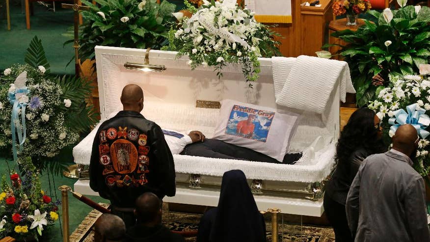 The Latest On Baltimore Police Custody Death Mourners File Past
