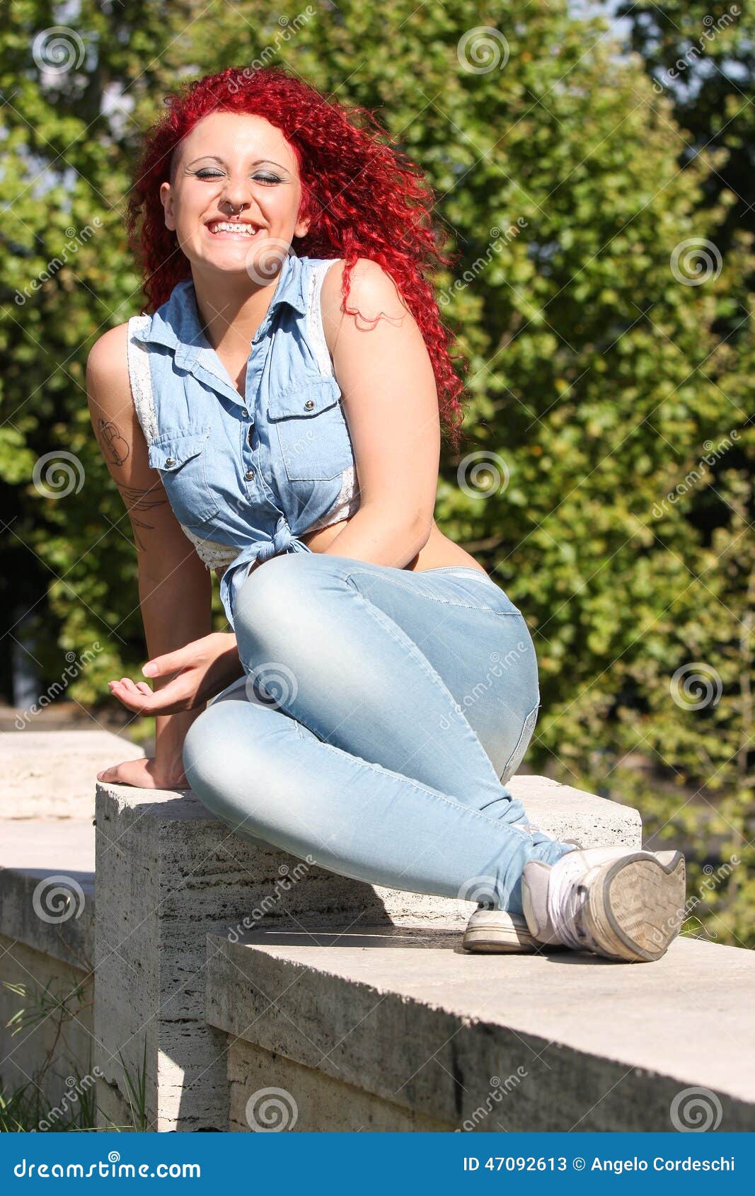 Young Girl Smiling Red Curly Hair And Piercing Outdoor