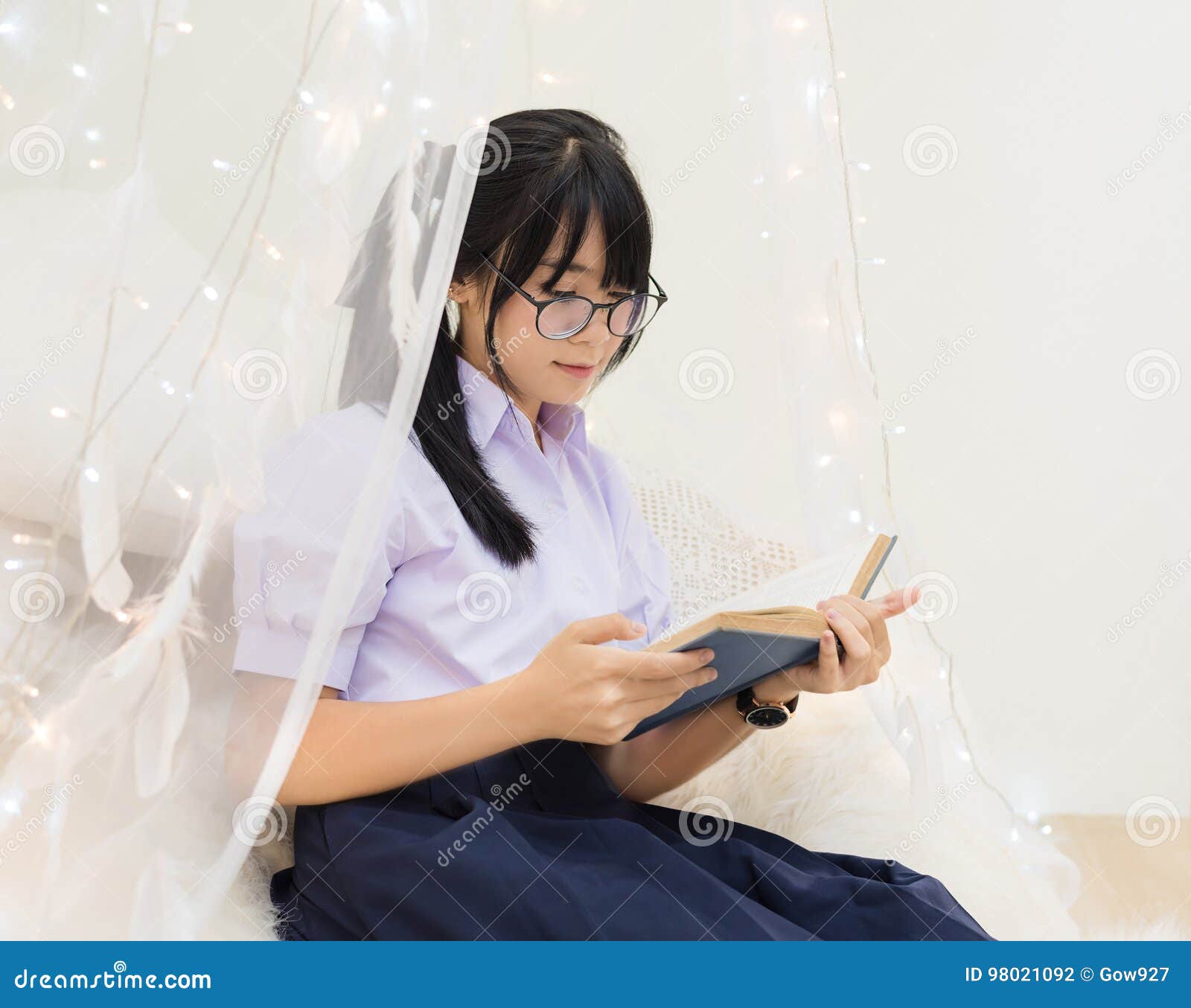 Asian Thai High School Girl In Uniform Glasses Sit Reading