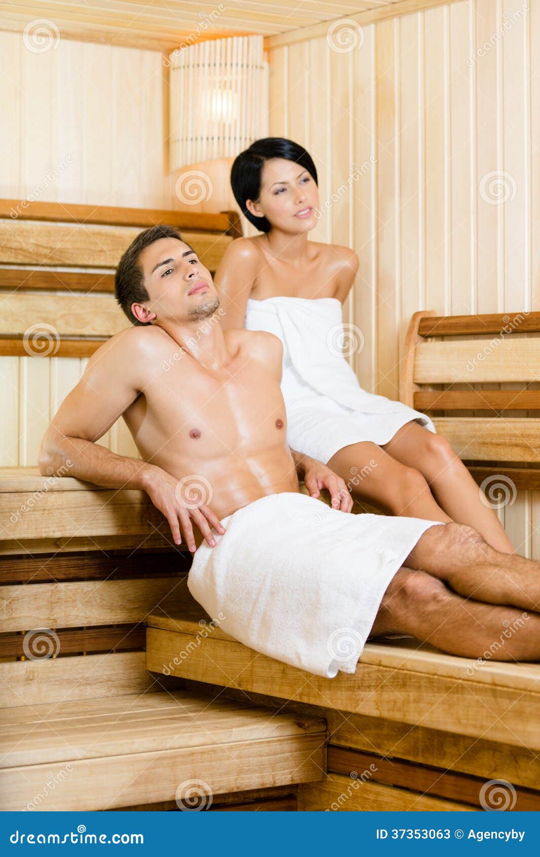 Half Naked Man And Young Woman Relaxing In Sauna Stock