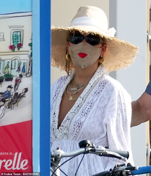Rita Ora Dons A Face Mask Embroidered With A Pair Of Red Lips Daily