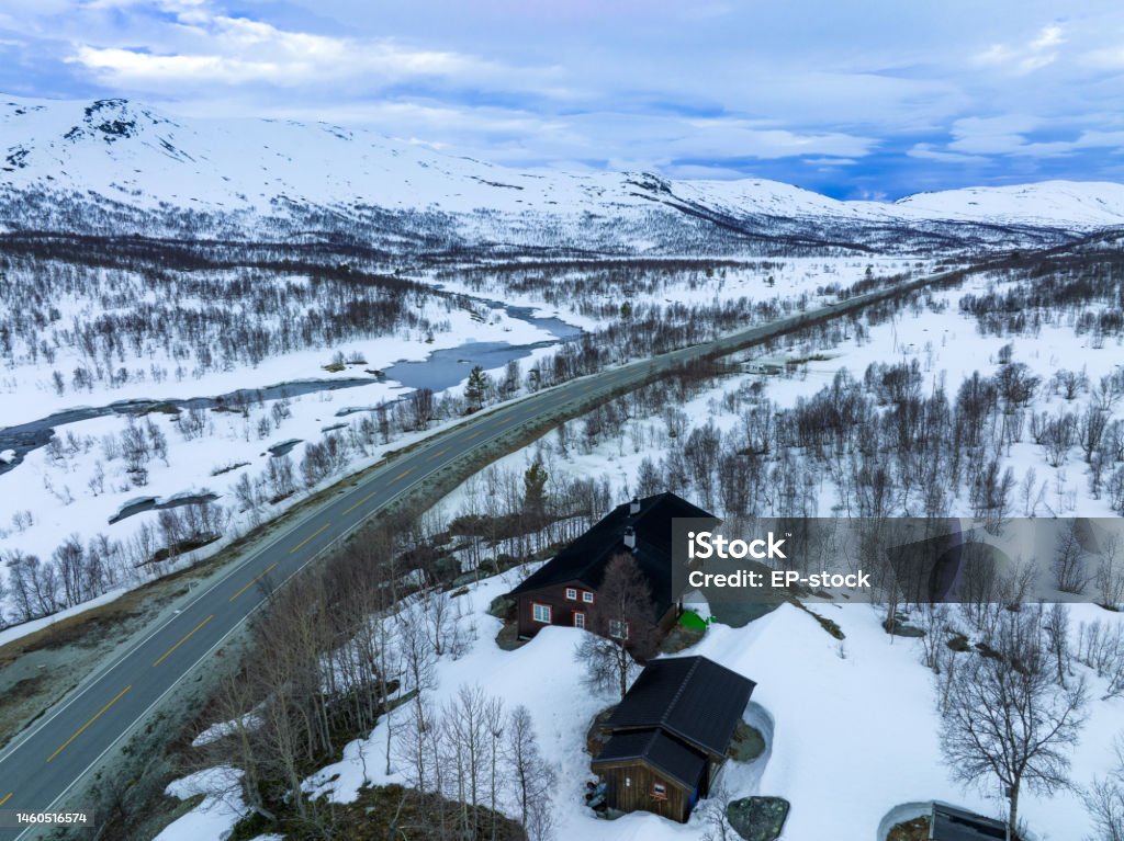 Aerial View Of Traditional Norwegian Cabin In Snow Reinheimen National