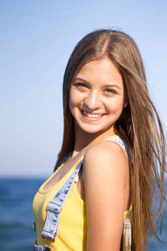 Happy Teenage Girl Smiling Enjoying Vacation At Summer Beach Stock