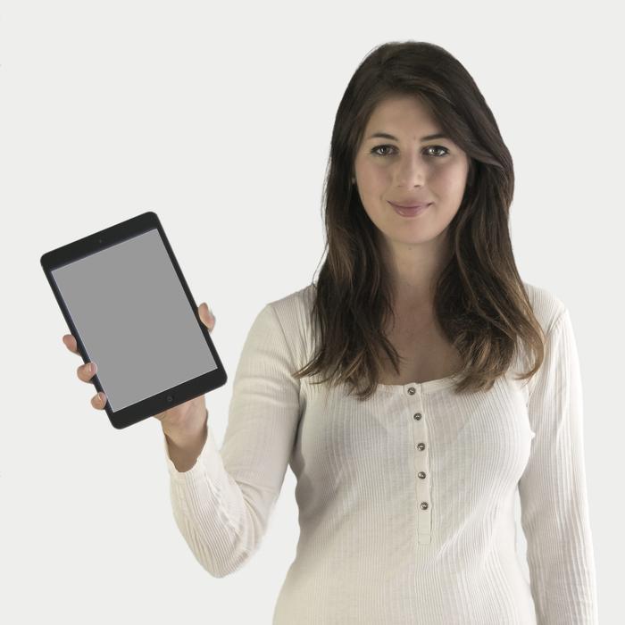 Brunette Holds A Tablet In Her Hand Free Image Download